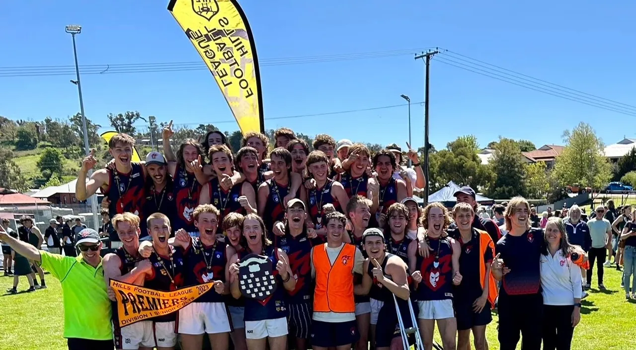 Under 18 boys premiership team photo with flag and shield